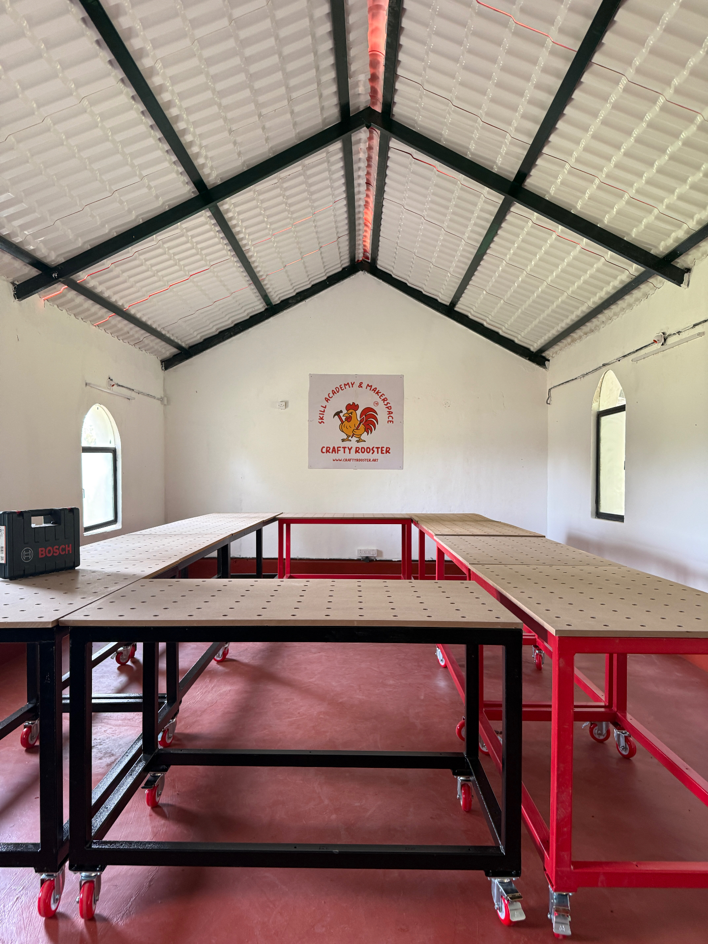 CraftyRooster studio seen from the worktables toward the high pitched roof